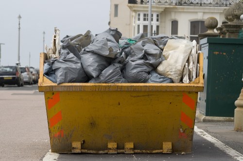 Branded skip on street at job start